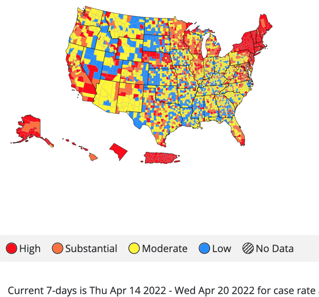 Map of the U.S. by county, showing red (high transmission) across New England and scattered in other regions including the Midwest, Nebraska, California; the rest is yellow (moderate) and blue (low) transmission.