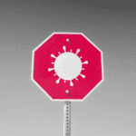 Red stop with COVID virus graphic instead of text